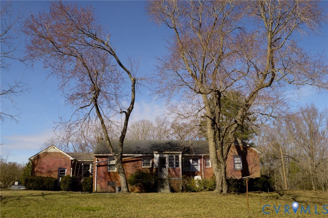 2500 Maidens Road, Powhatan, VA 23139 Single story home with brick siding and a front yard