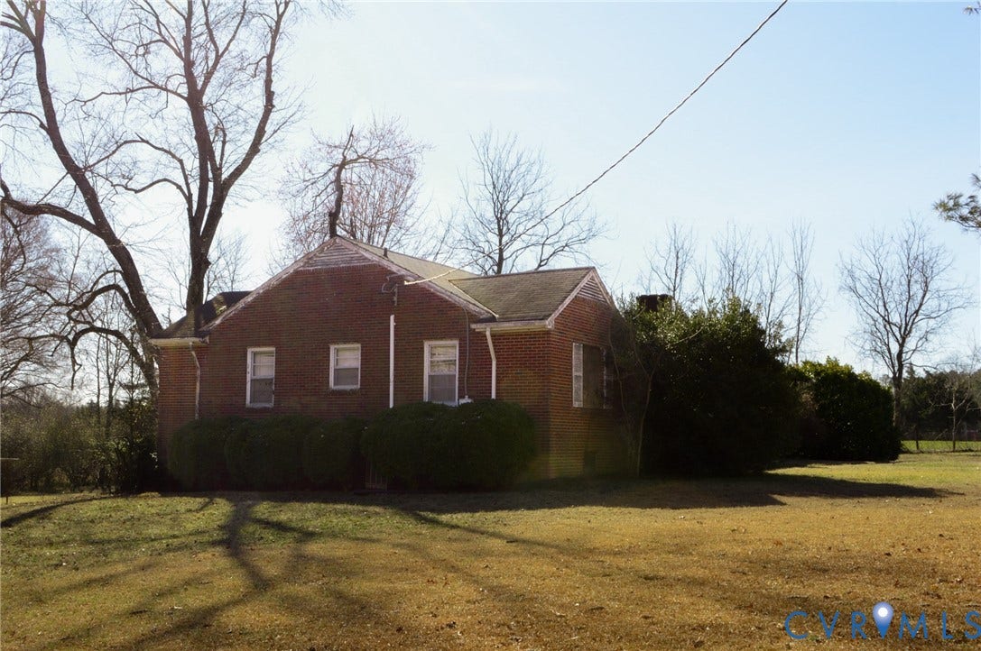 2500 Maidens Road, Powhatan, VA 23139 View of property exterior with a yard and brick siding