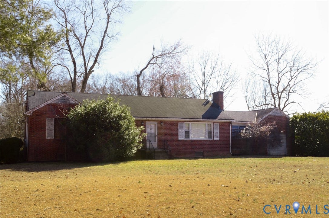 2500 Maidens Road, Powhatan, VA 23139 View of front of house featuring brick siding, a chimney, and a front yard