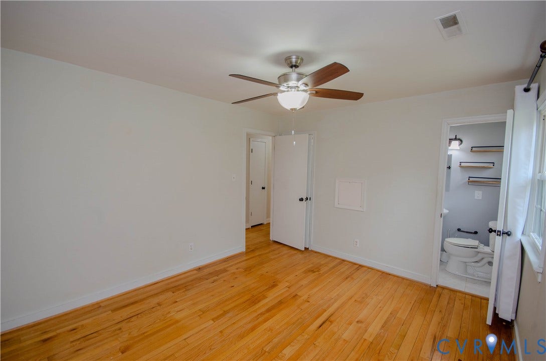 2231 Fall Line Drive, Powhatan, VA 23139 Unfurnished bedroom with light wood-style floors, a ceiling fan, and ensuite bath