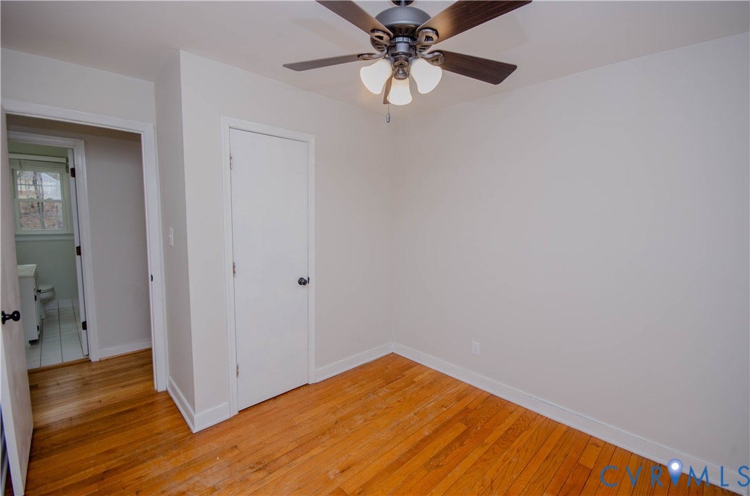 2231 Fall Line Drive, Powhatan, VA 23139 Unfurnished bedroom with light wood-style floors, a ceiling fan, and a closet