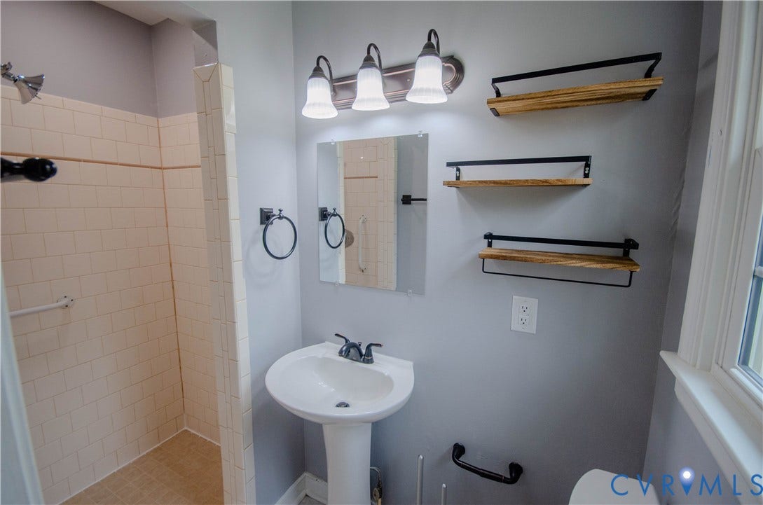 2231 Fall Line Drive, Powhatan, VA 23139 Bathroom with a shower stall and toilet