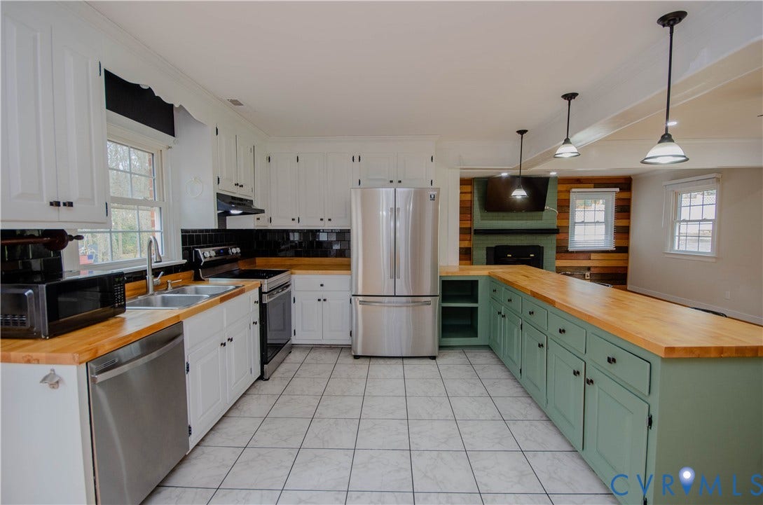 2231 Fall Line Drive, Powhatan, VA 23139 Kitchen featuring wood counters, stainless steel appliances, dual tone cabinetry, plenty of natural light, and hanging light fixtures