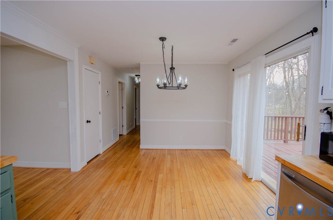 2231 Fall Line Drive, Powhatan, VA 23139 Unfurnished dining area with light wood-style floors and a chandelier