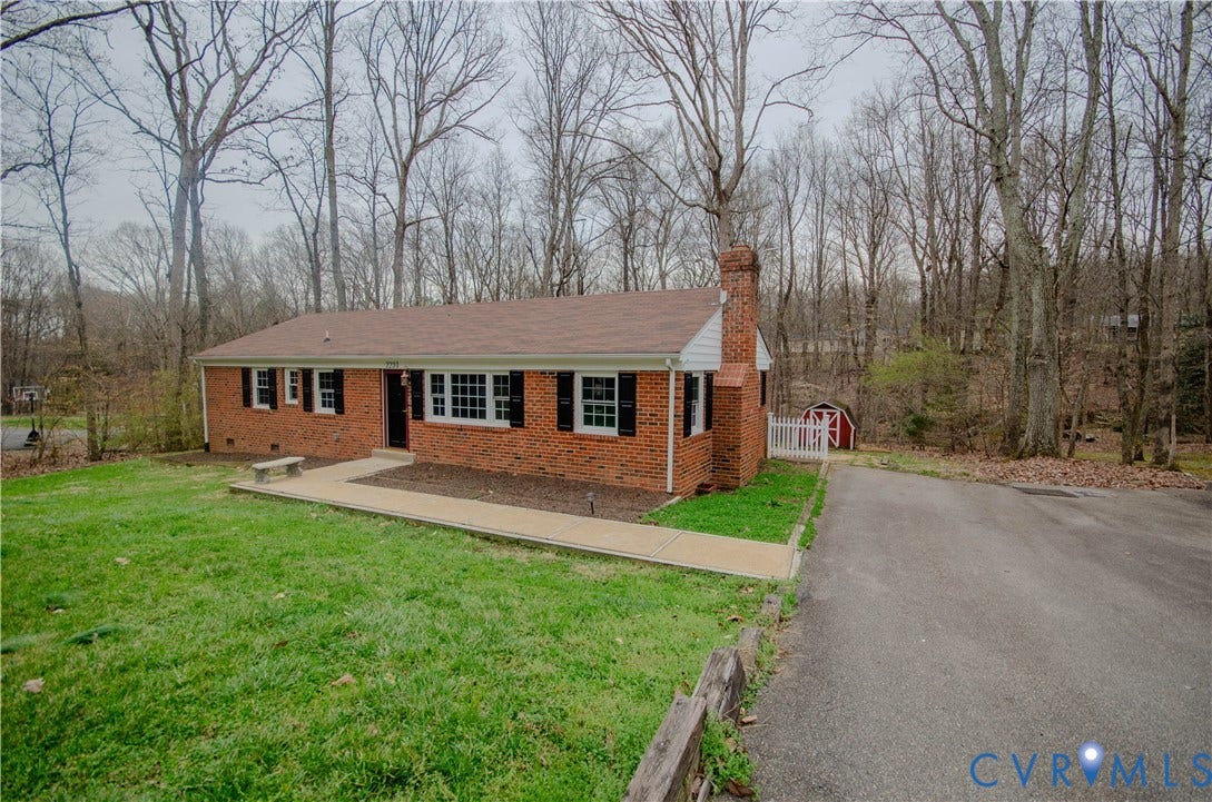 2231 Fall Line Drive, Powhatan, VA 23139 Single story home featuring a chimney, a front lawn, brick siding, crawl space, and a patio
