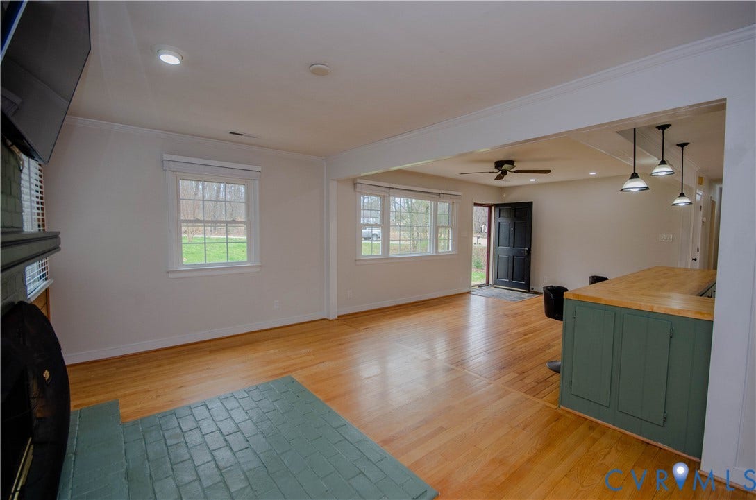2231 Fall Line Drive, Powhatan, VA 23139 Living area featuring light wood finished floors, ceiling fan, a fireplace, ornamental molding, and recessed lighting