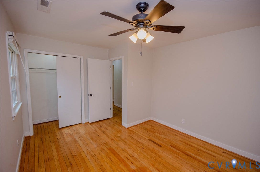 2231 Fall Line Drive, Powhatan, VA 23139 Unfurnished bedroom with light wood-style flooring, a closet, and ceiling fan