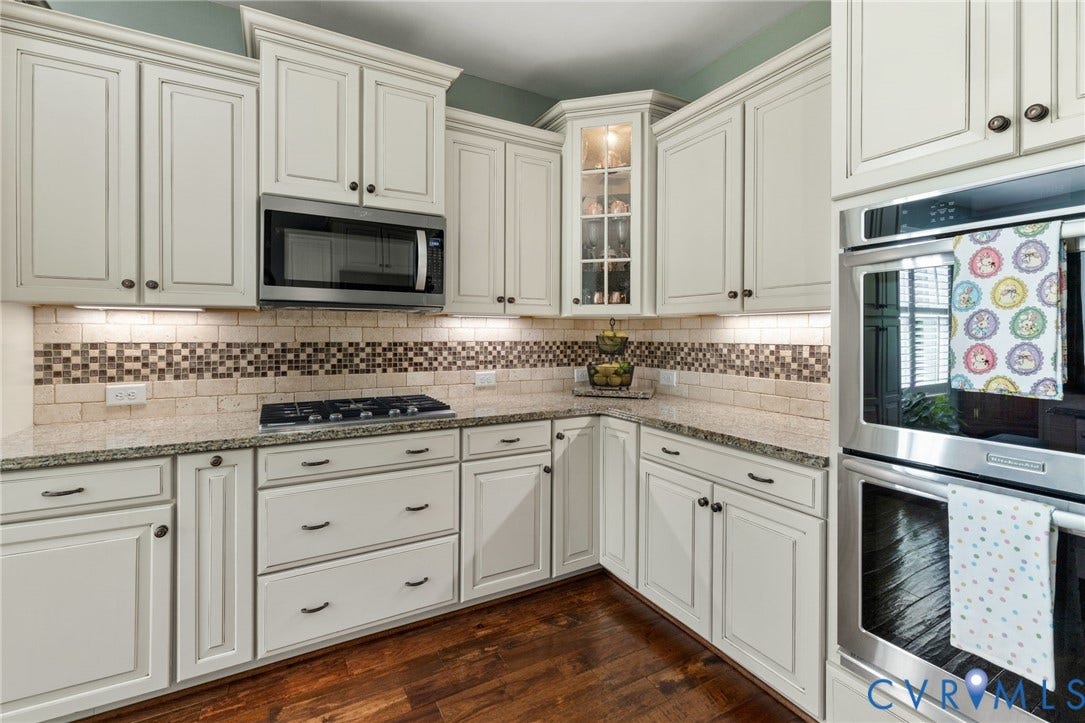 1493 Camberley Drive, Parke At Saddlecreek, Manakin Sabot, VA 23103 stainless steel appliances, 5-burner gas cooktop, double wall oven, tile backsplash