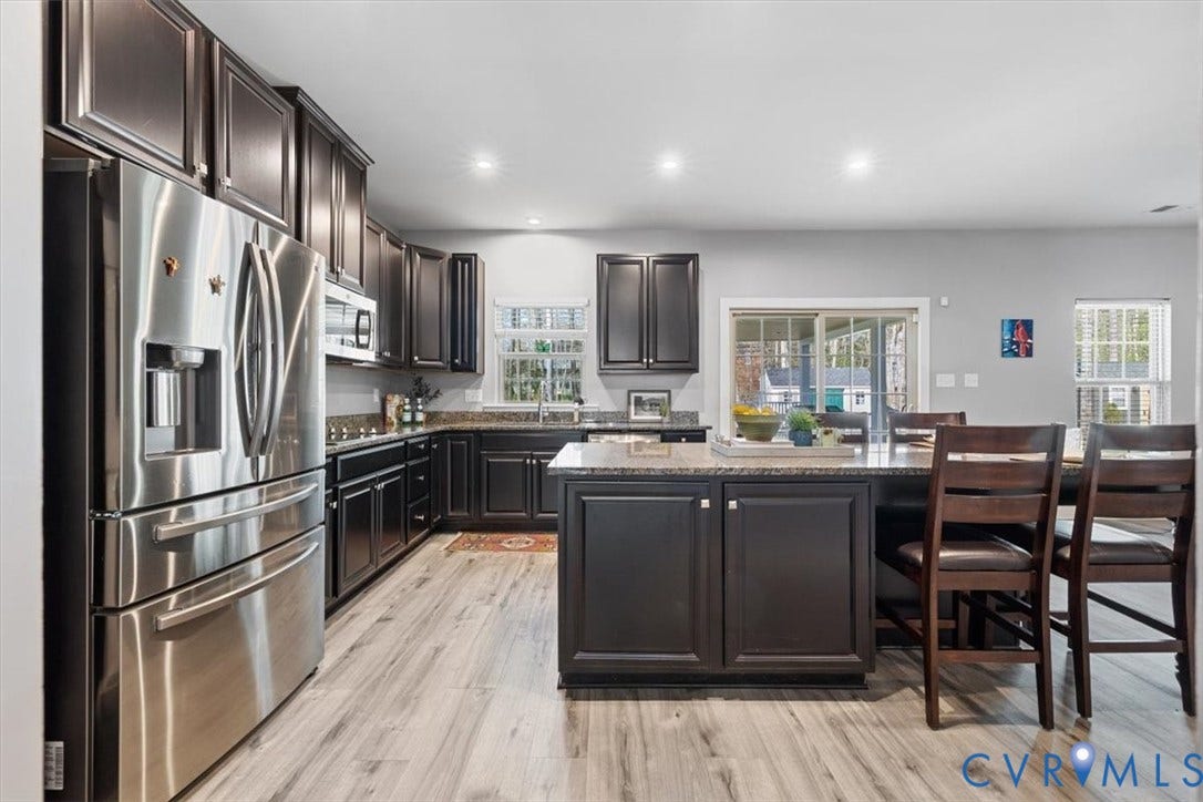 10448 Centralia Station Road, Chesterfield, VA 23831 Stainless steel appliances and granite counter tops highlight this spacious and open kitchen