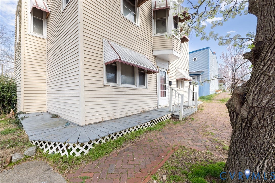 2606 Cedar Street, Richmond, VA 23223 View of side of home featuring a wooden deck