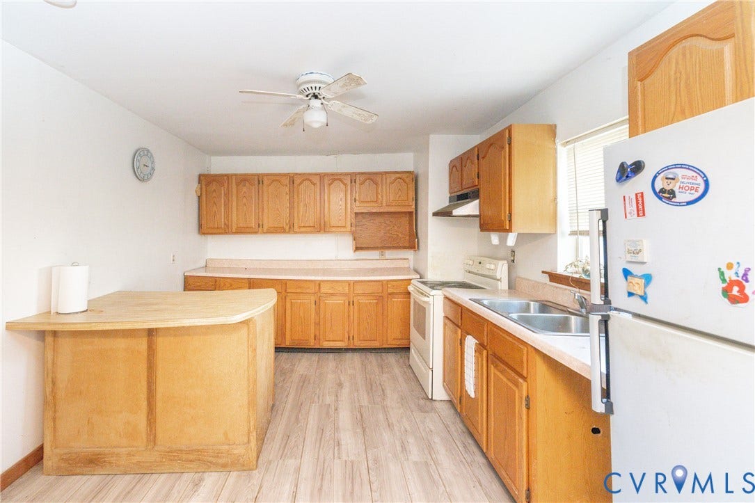 2606 Cedar Street, Richmond, VA 23223 Kitchen with white appliances, light countertops, a ceiling fan, and light wood-style floors