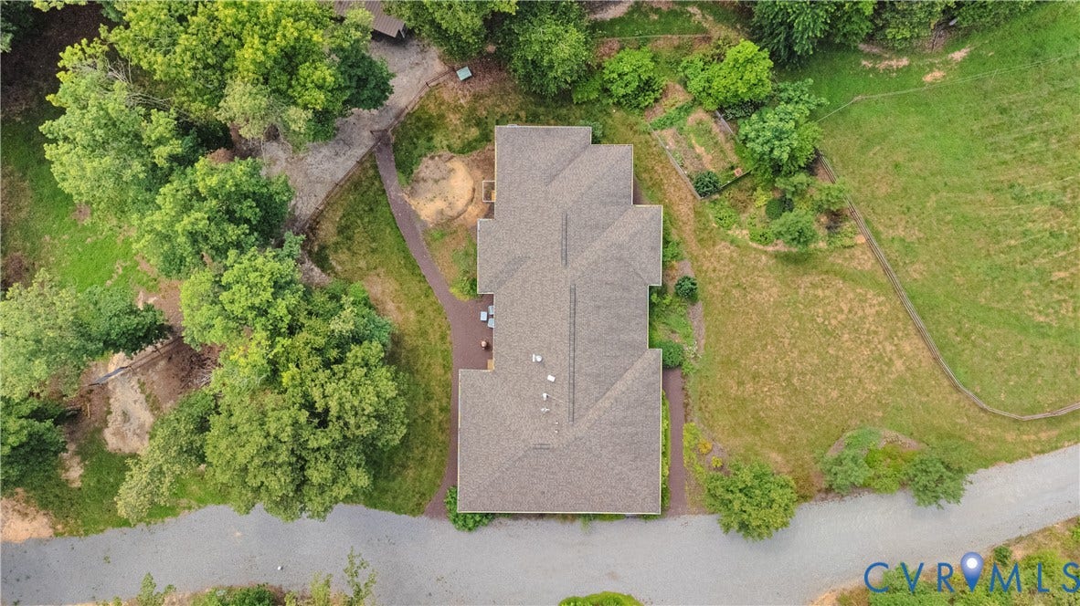 4337 Riddles Bridge Road, Riddles Bridge, Goochland, VA 23063 Property featuring a multi-gabled roofline, surrounding mature trees, and a terraced garden area