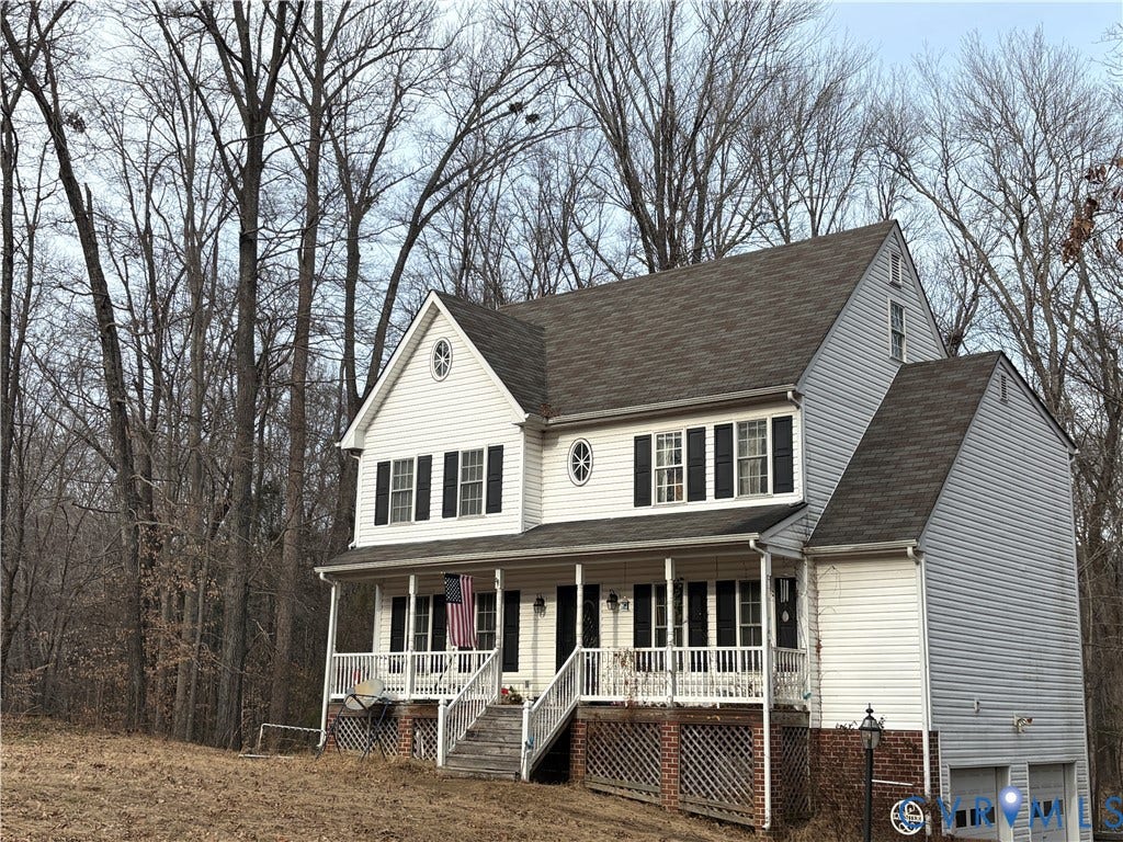 3216 Sherwood Bluff Terrace, Powhatan, VA 23139 View of front of home with covered porch, a garage, and a shingled roof