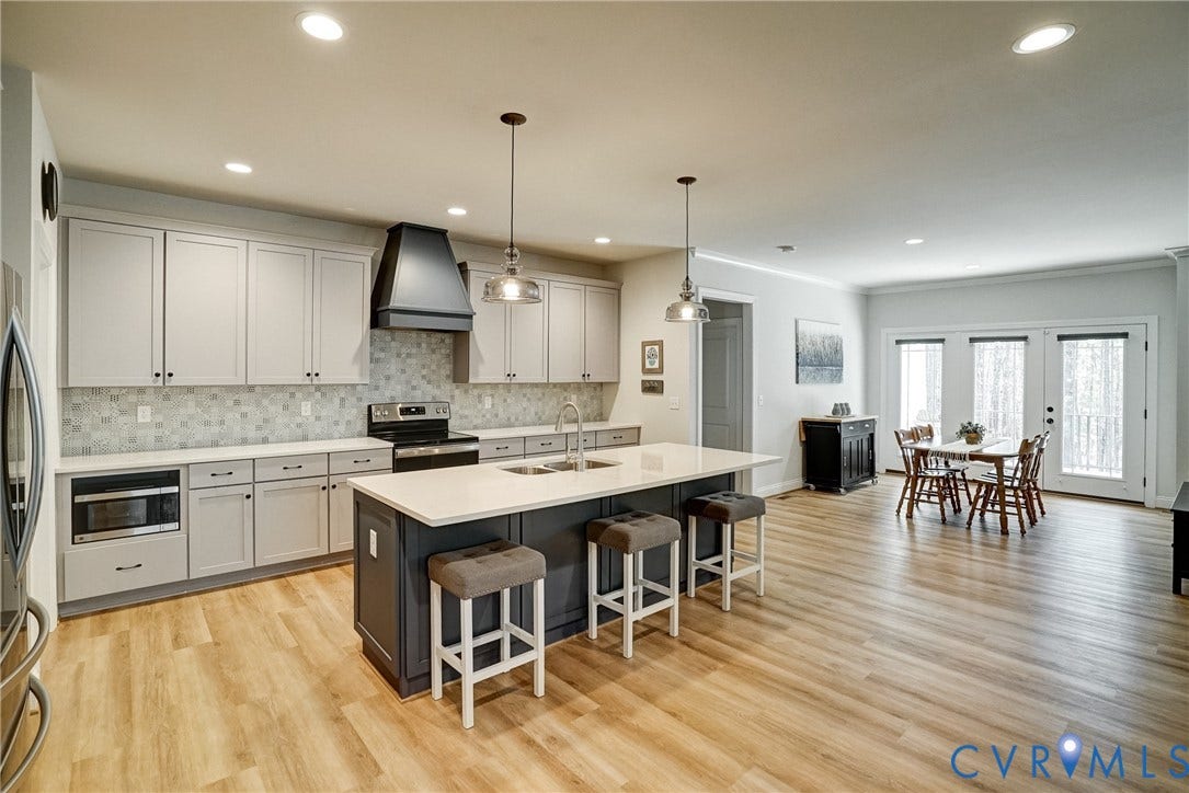 12387 S Readers Circle, Readers Branch, Manakin Sabot, VA 23103 Kitchen with Tons of Cabinets, Decorative Backsplash, Pantry, Recessed Lighting, and Spacious Dining Area