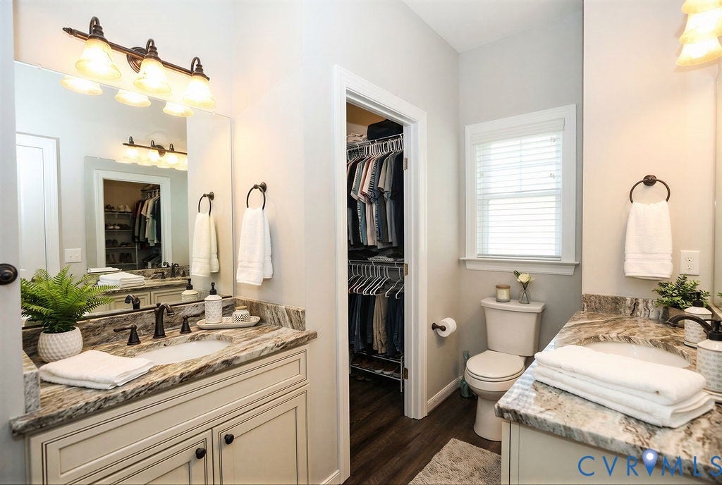 5670 Hickory Street, Powhatan, VA 23139 Bathroom featuring two vanities, dark wood-style flooring, and a walk in closet