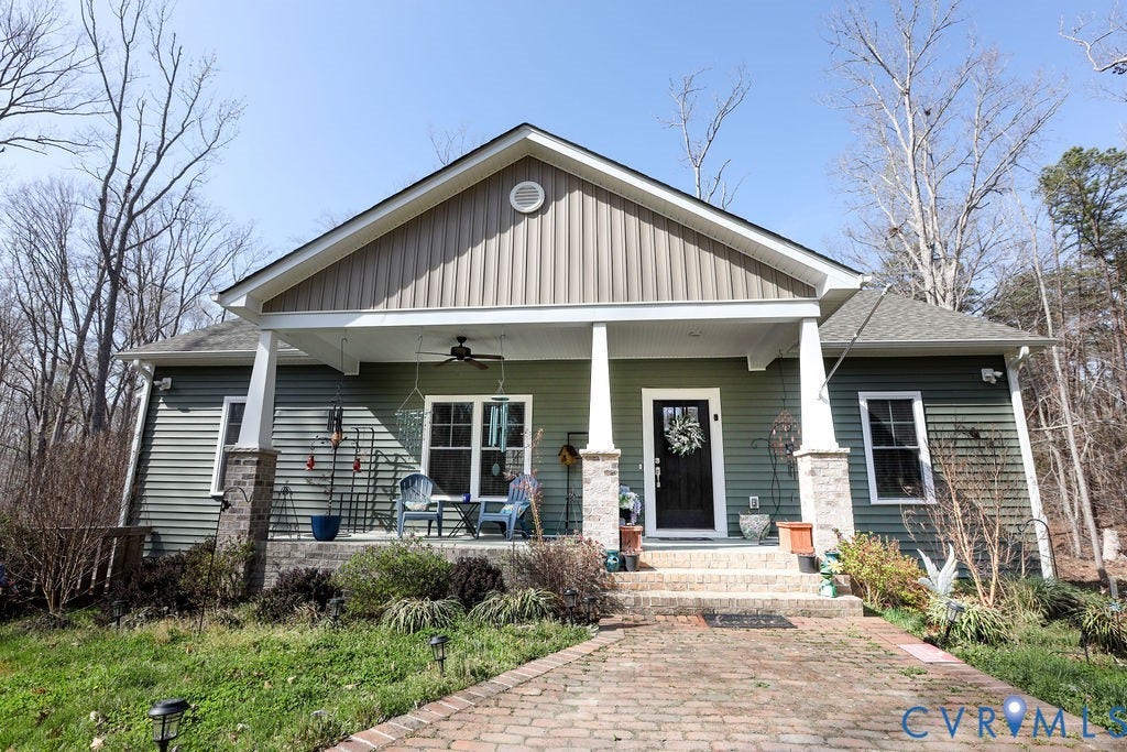 5670 Hickory Street, Powhatan, VA 23139 Craftsman inspired home featuring a ceiling fan, a porch, board and batten siding, and a shingled roof