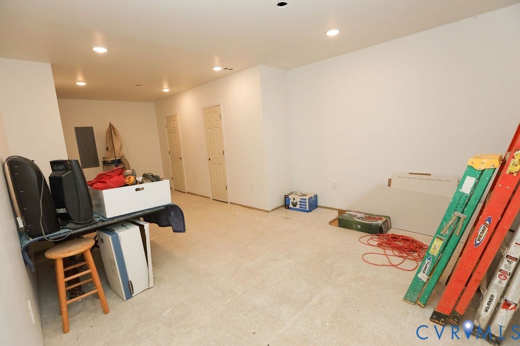 5670 Hickory Street, Powhatan, VA 23139 Game room with water heater, recessed lighting, electric panel, and light carpet