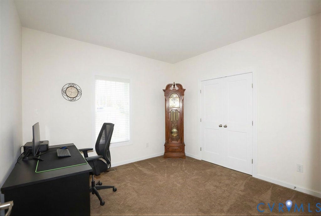 5670 Hickory Street, Powhatan, VA 23139 Home office with dark colored carpet and baseboards