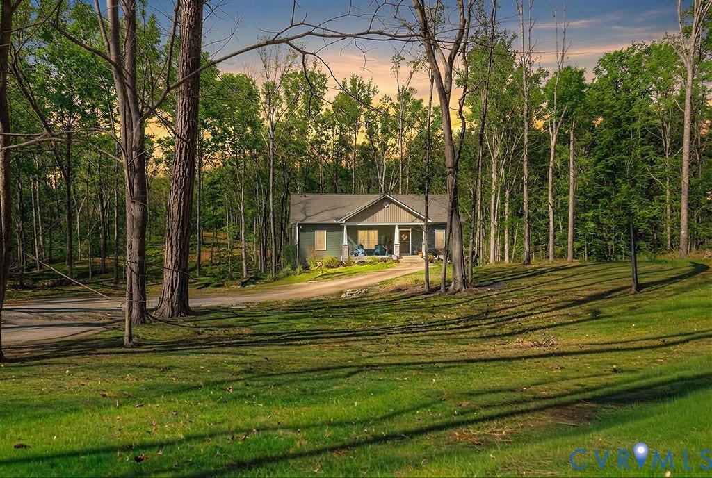 5670 Hickory Street, Powhatan, VA 23139 View of front of property featuring a porch, a lawn, and driveway