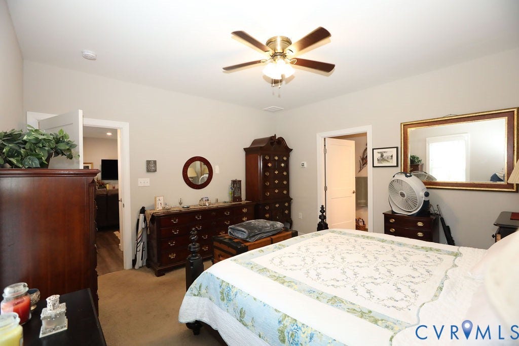 5670 Hickory Street, Powhatan, VA 23139 Bedroom with light colored carpet and a ceiling fan