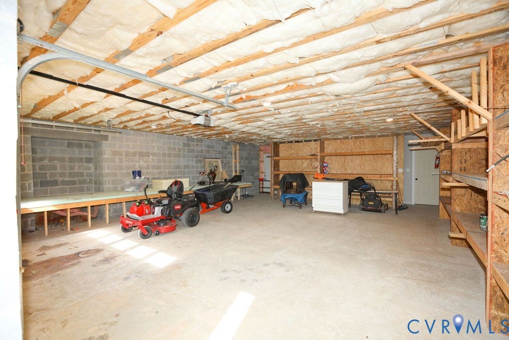 5670 Hickory Street, Powhatan, VA 23139 Garage with concrete block wall and a garage door opener