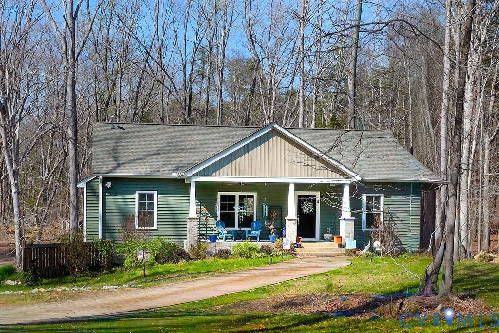 5670 Hickory Street, Powhatan, VA 23139 View of front facade featuring a porch, roof with shingles, and a front yard