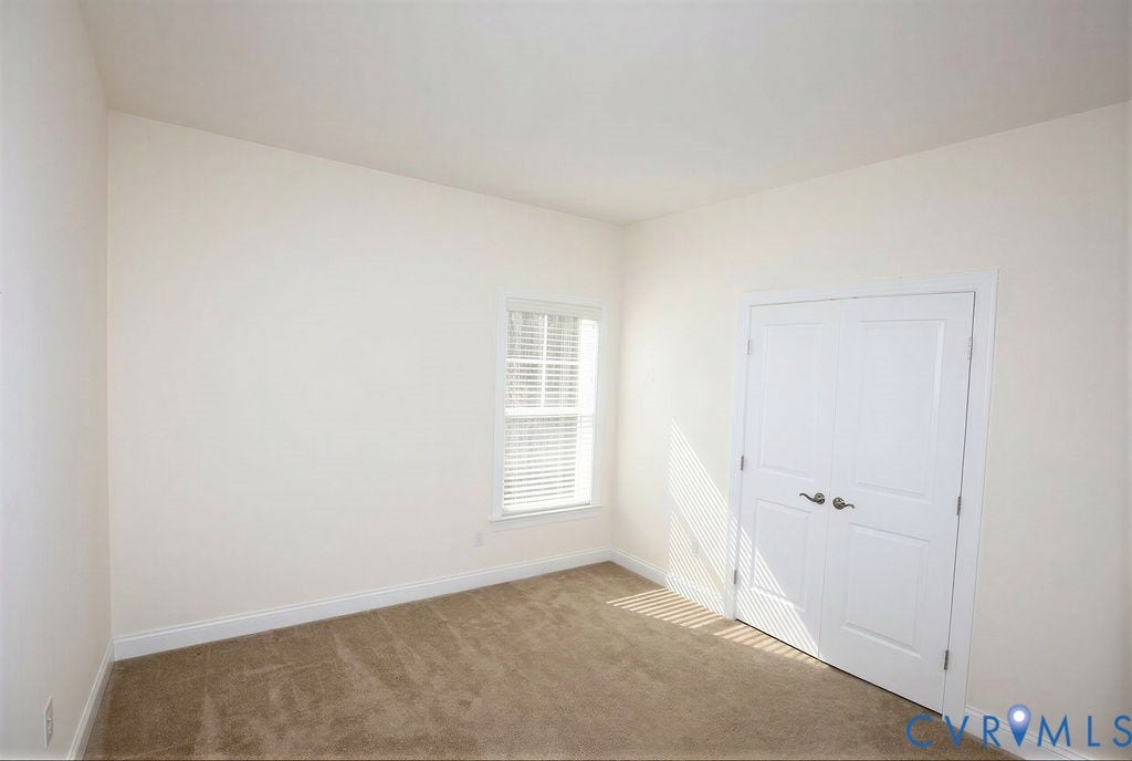 5670 Hickory Street, Powhatan, VA 23139 Unfurnished bedroom with light carpet and a closet