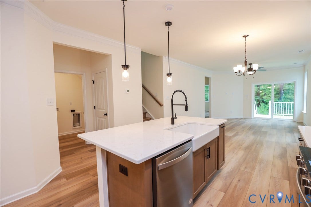 6305 Lila Crest Lane, Cottages At Millwood, Chesterfield, VA 23112 The photo represents the plan, not the actual home. Design selections may vary. This home features a kitchen with a large island that elevates the look and the walk-in pantry.