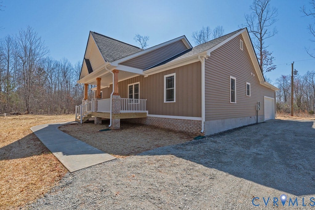TBD Black Haw Lane, Hanover, VA 23059 View of home's exterior featuring covered porch, roof with shingles, driveway, and an attached garage
