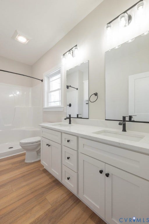 TBD Black Haw Lane, Hanover, VA 23059 Full bath featuring double vanity, light wood-type flooring, and a stall shower