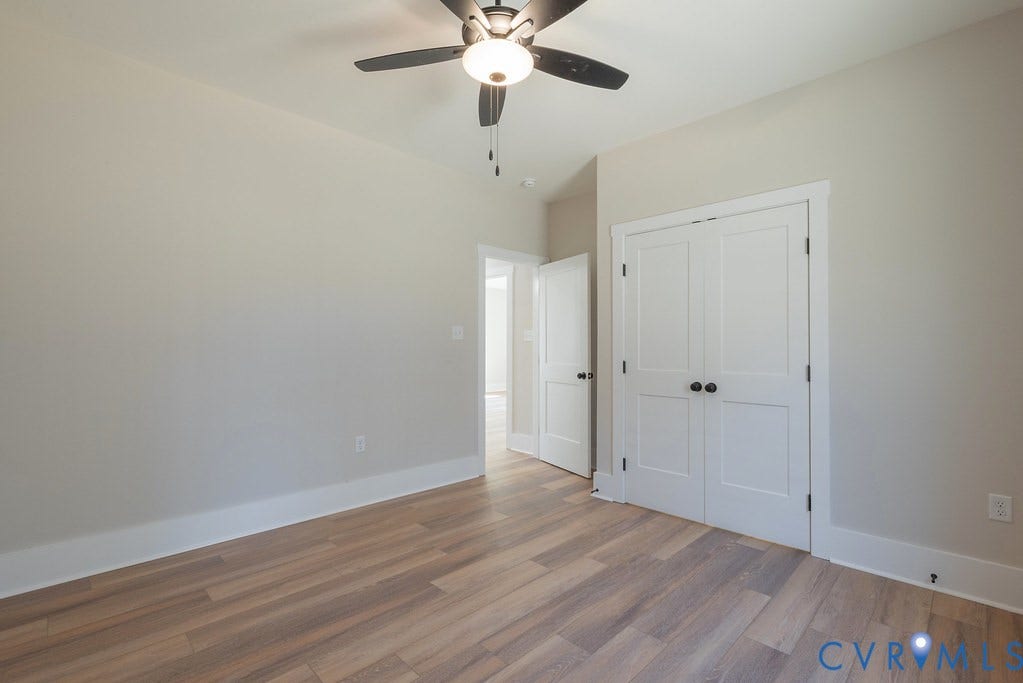 TBD Black Haw Lane, Hanover, VA 23059 Unfurnished bedroom with wood finished floors, ceiling fan, and a closet