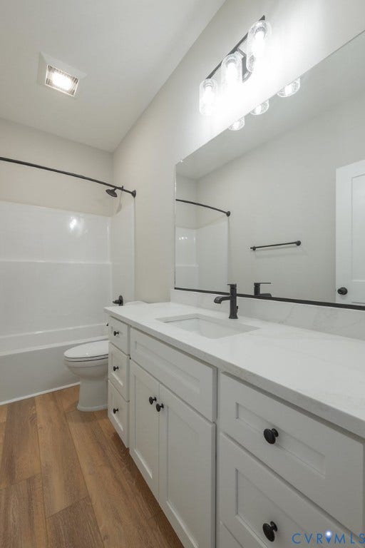 TBD Black Haw Lane, Hanover, VA 23059 Bathroom with vanity, dark wood-type flooring, and shower / washtub combination