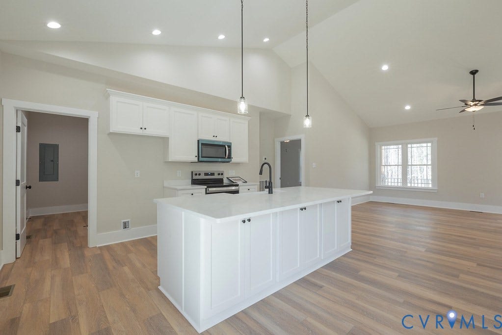 TBD Black Haw Lane, Hanover, VA 23059 Kitchen with white cabinets, open floor plan, stainless steel appliances, a center island with sink, and light wood-type flooring