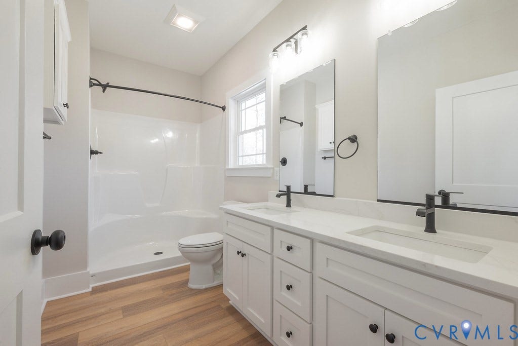 TBD Black Haw Lane, Hanover, VA 23059 Full bathroom with a stall shower, double vanity, and light wood finished floors