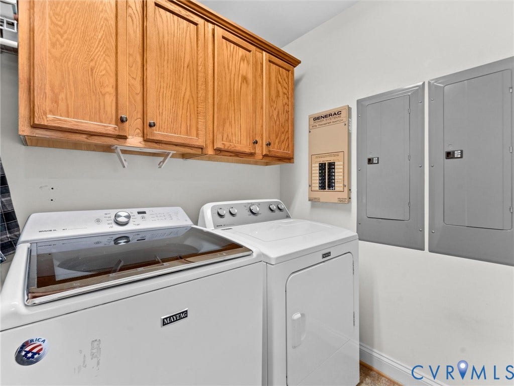 110 Oak Knoll Place, Bumpass, VA 23024 Private laundry room with cabinetry, built in ironing board, electric and generator panel access, tile floors