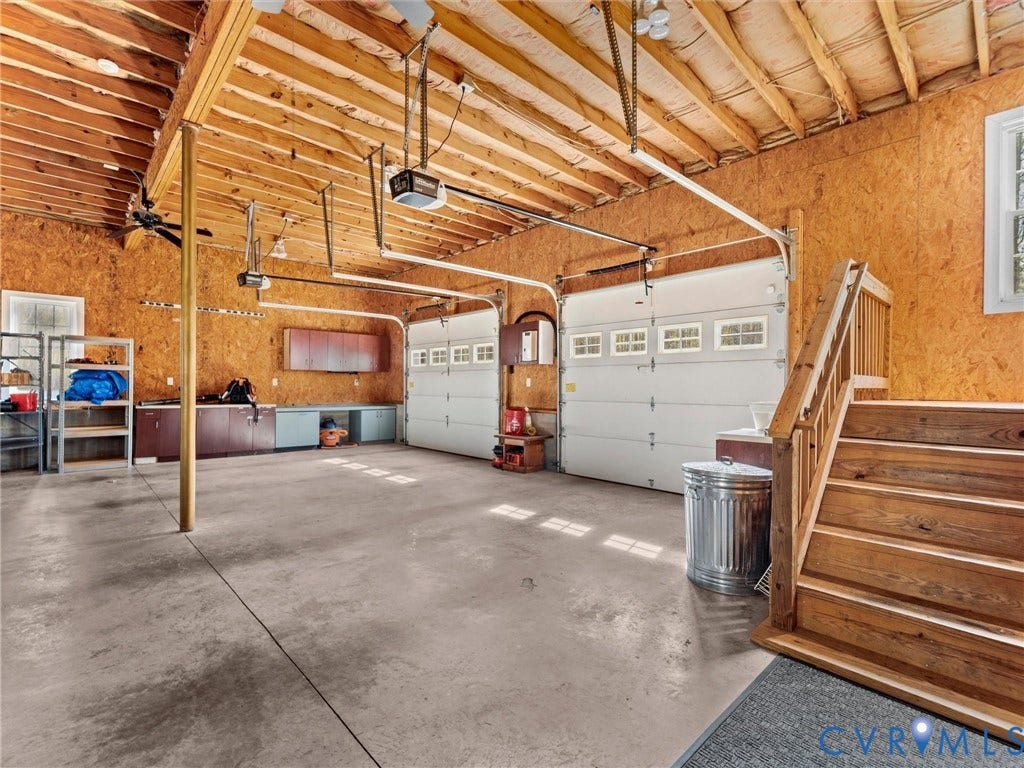 110 Oak Knoll Place, Bumpass, VA 23024 Double bay garage that is oversized and there is plenty of room for cars and toys