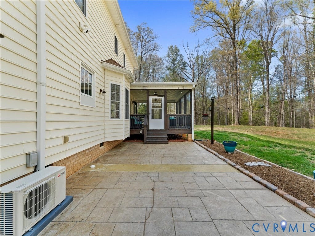 110 Oak Knoll Place, Bumpass, VA 23024 Stamped concrete patio has plenty of space to barbecue and entertain