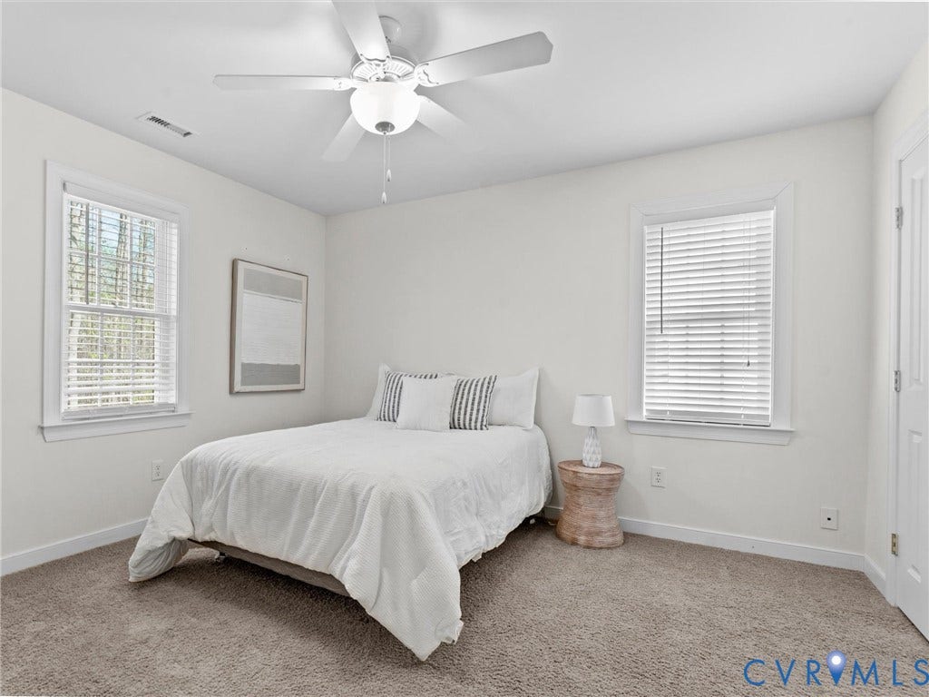 110 Oak Knoll Place, Bumpass, VA 23024 2nd bedroom with carpet, two closets, and ceiling fan