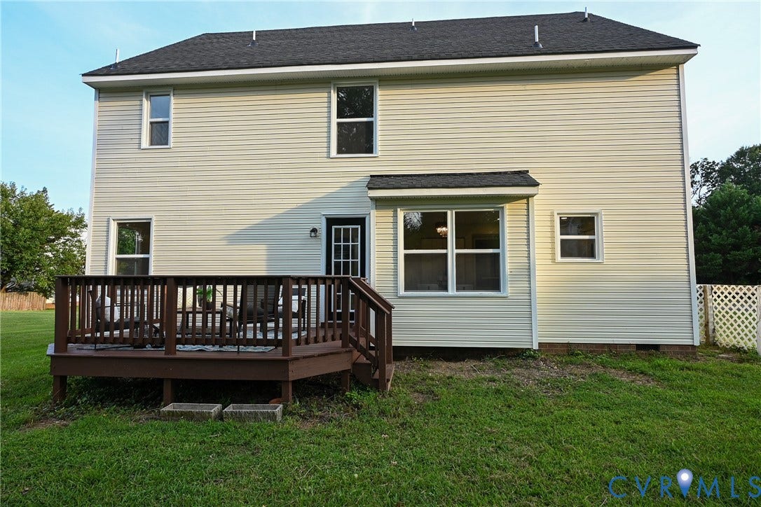 912 Harmony Road, Fairfield, VA 23059 Two-story home featuring cream-colored vinyl siding, a dark asphalt shingle roof, and multiple windows providing natural light