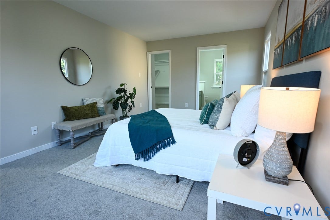 912 Harmony Road, Fairfield, VA 23059 Primary Bedroom featuring neutral wall finishes, carpet flooring, and abundant natural light from multiple windows