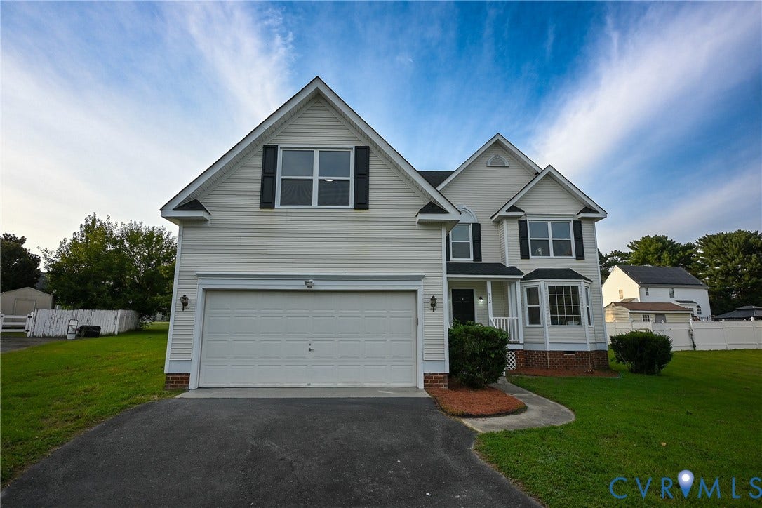 912 Harmony Road, Fairfield, VA 23059 Two-story home with light-colored siding, a two-car garage, and a covered entryway