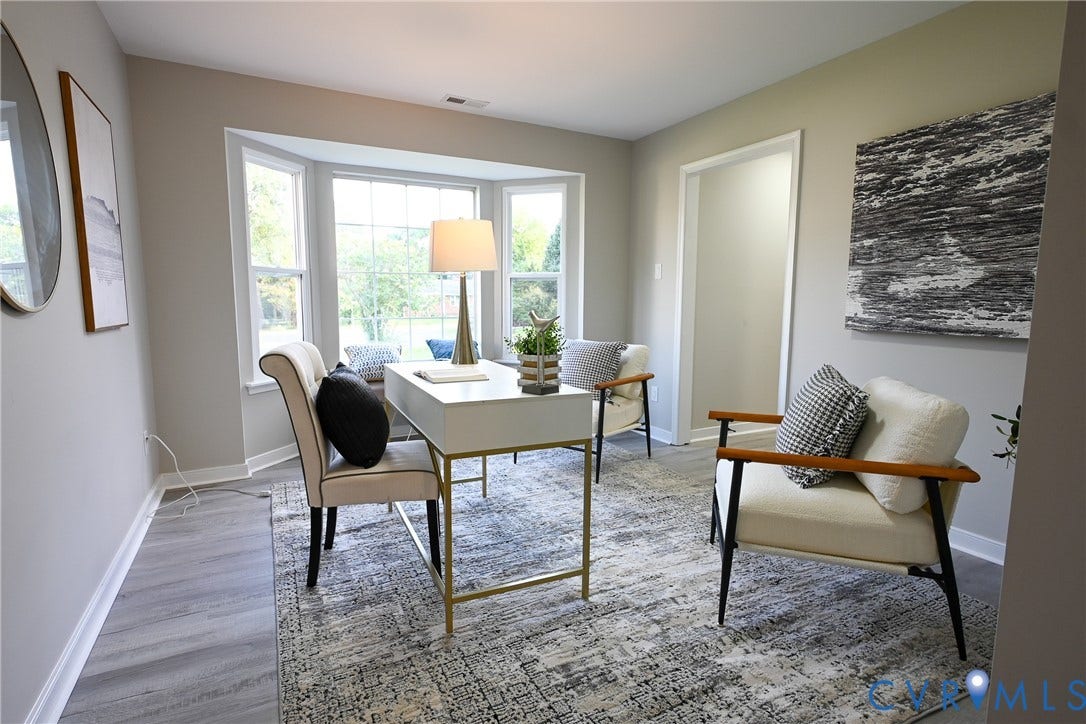912 Harmony Road, Fairfield, VA 23059 Bay window with multiple panels, light gray wall paint, and wood-finish flooring
