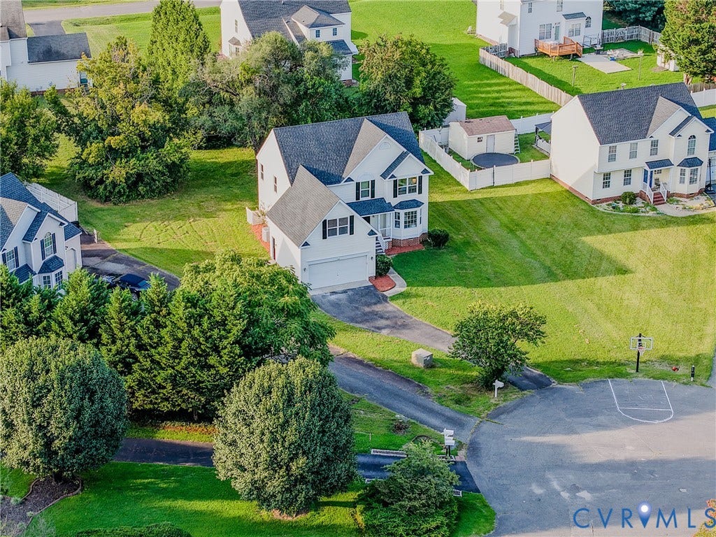 912 Harmony Road, Fairfield, VA 23059 Charming two-story colonial residence set on expansive grounds featuring mature landscaping, manicured lawn, and established shade trees