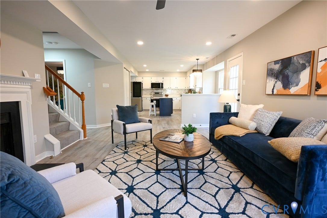 912 Harmony Road, Fairfield, VA 23059 Open-concept living space with wood-finish flooring, recessed lighting, and a fireplace with a white mantel