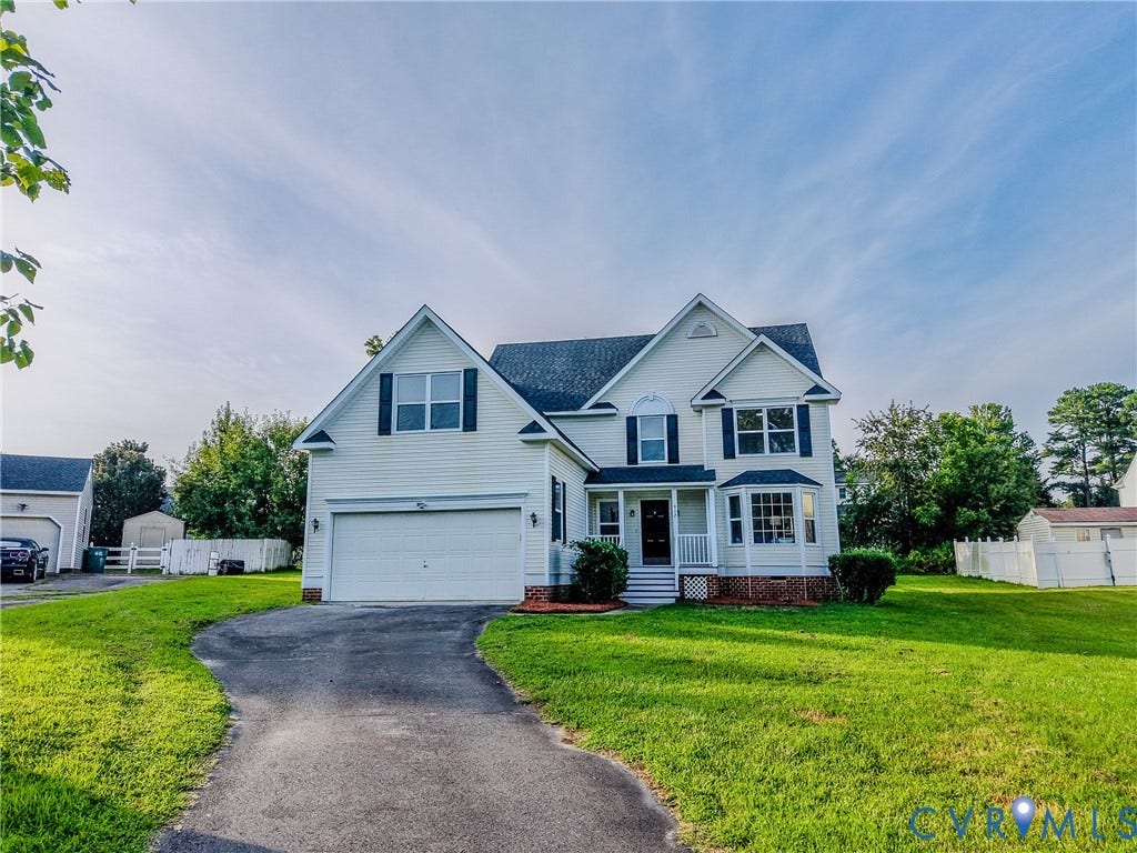 912 Harmony Road, Fairfield, VA 23059 Classic two-story Colonial featuring white exterior siding, multi-pane windows, and a front-facing gable design
