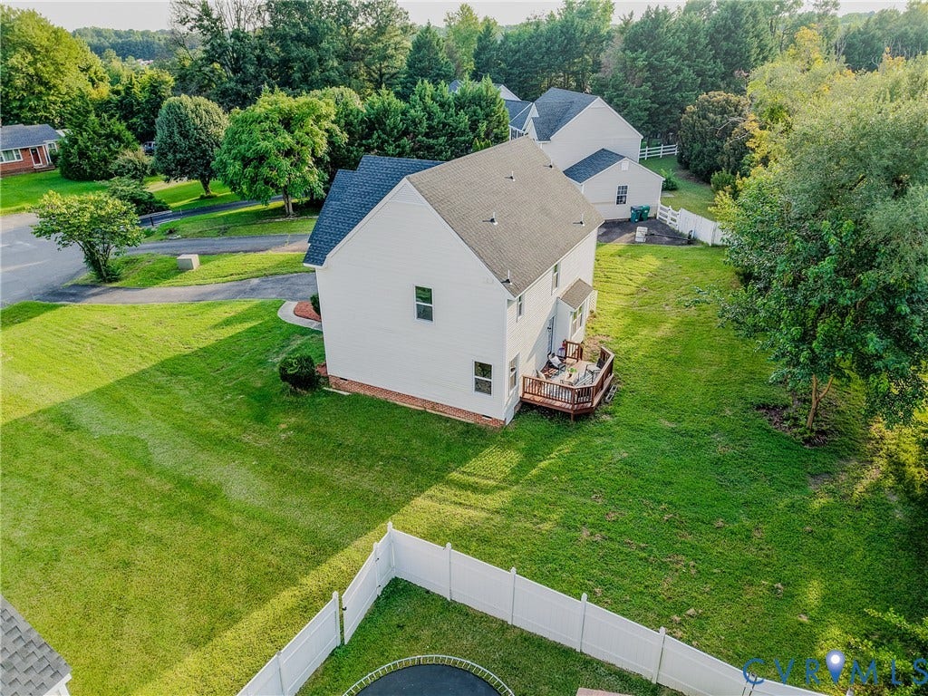 912 Harmony Road, Fairfield, VA 23059 Charming Colonial-style residence set on expansive manicured grounds with mature landscaping