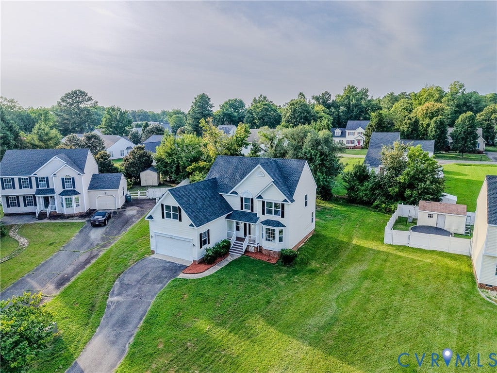 912 Harmony Road, Fairfield, VA 23059 Charming Colonial-style residence set on expansive manicured grounds with mature landscaping