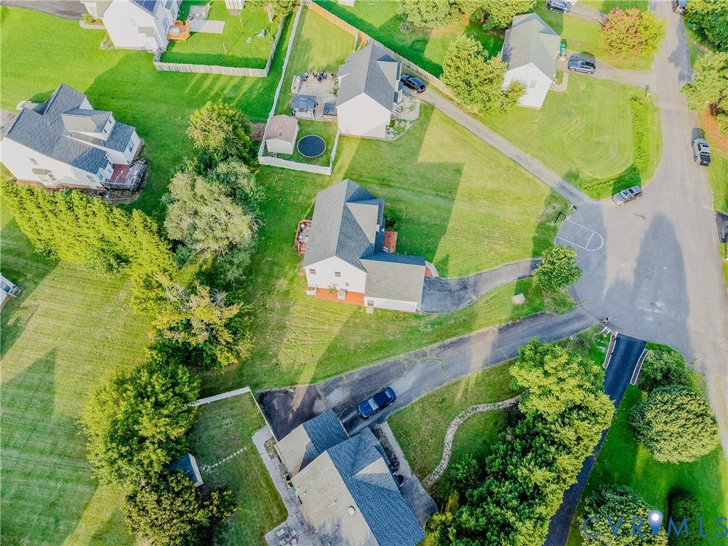 912 Harmony Road, Fairfield, VA 23059 Aerial view showcasing a residence situated on a generously proportioned lot with mature landscaping, manicured lawn, and established trees throughout the property