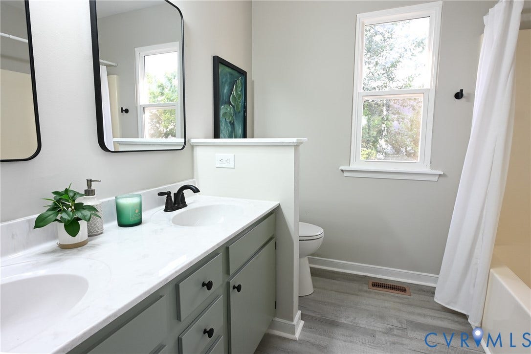 912 Harmony Road, Fairfield, VA 23059 Spa-inspired bathroom featuring dual vanities with soft-close cabinetry, white quartz countertop, and matte black faucetry