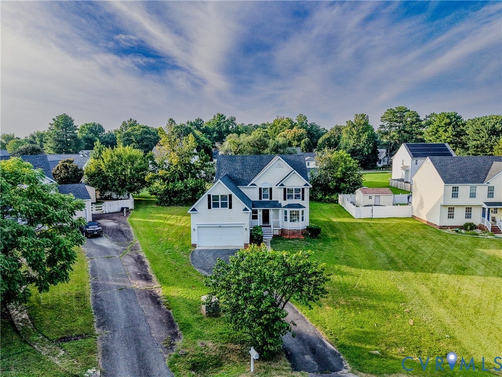 912 Harmony Road, Fairfield, VA 23059 Two-story residence with white siding and dark shutters